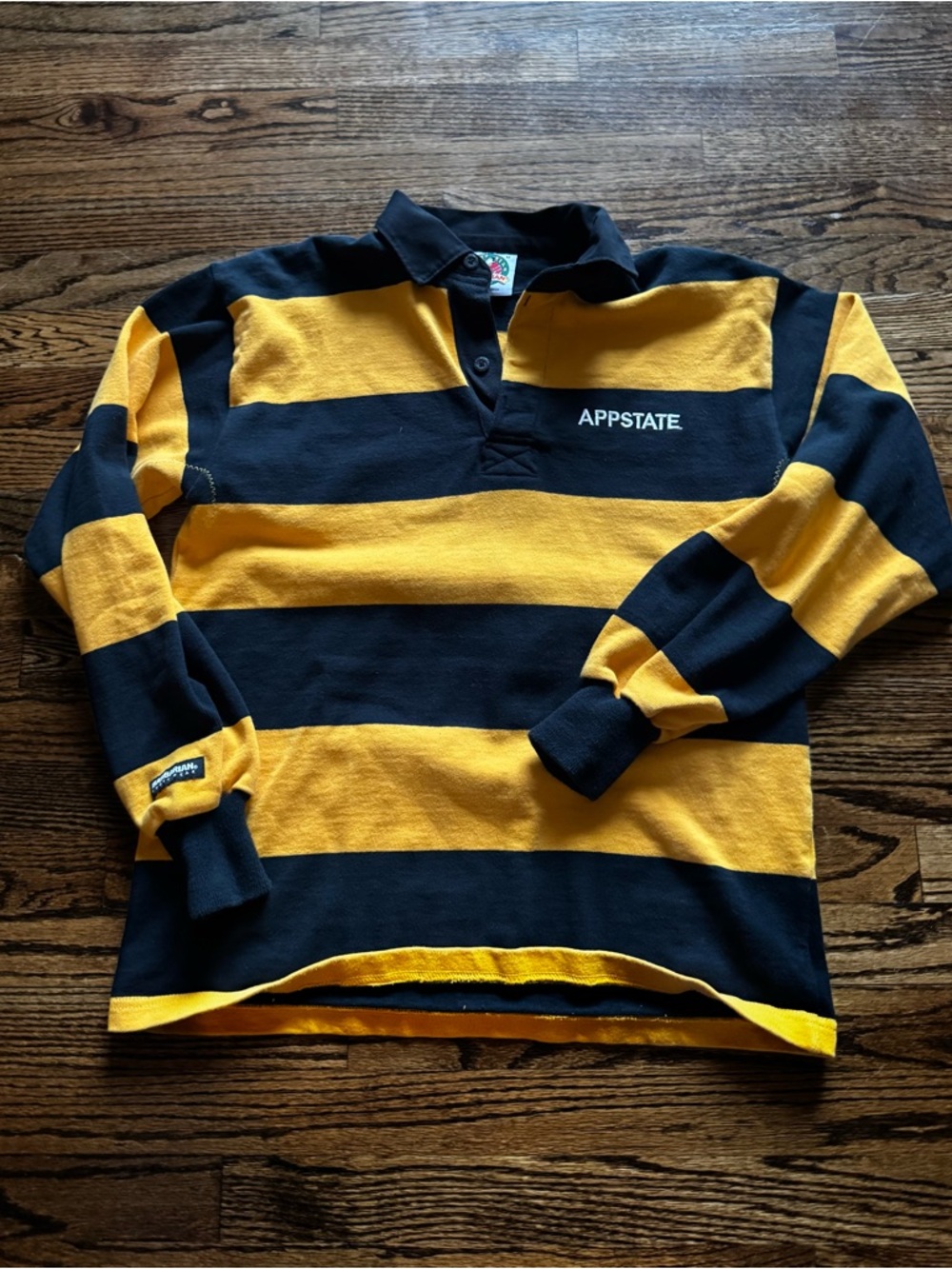 AppState Black and Gold Striped Rugby Polo